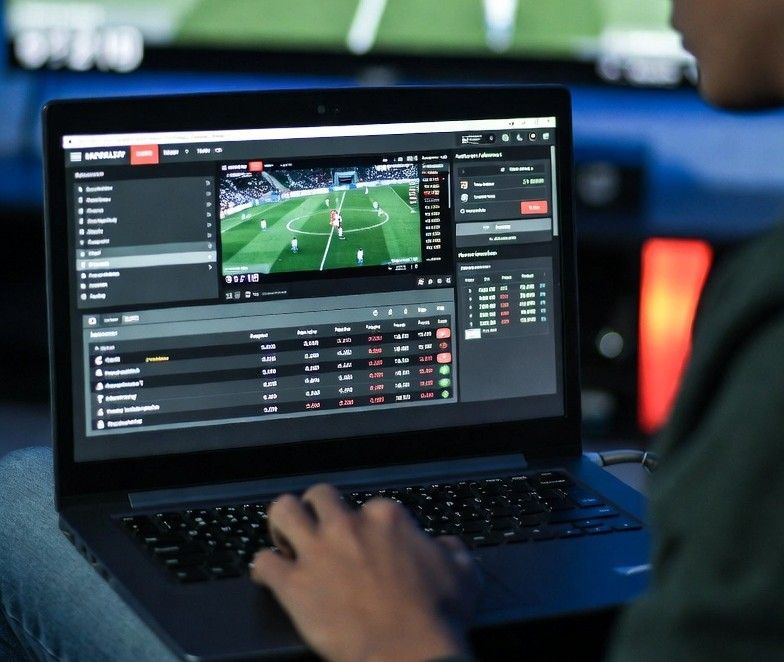 live sports broadcast with odds on laptop screen